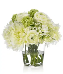 Flower Arrangement of White Agapanthus, Ranunculus and Dahlia in a Glass Vase